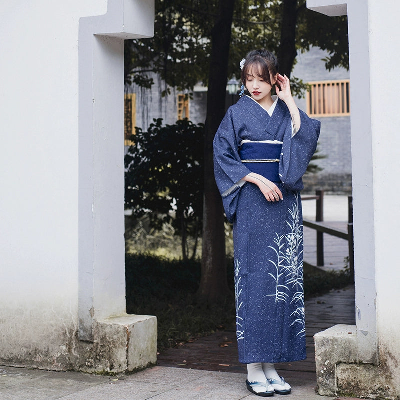 Full-length view of blue Japanese kimono yukata with white floral design.