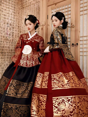 Elegant Yanji hanbok dress in red and black with intricate gold embroidery.