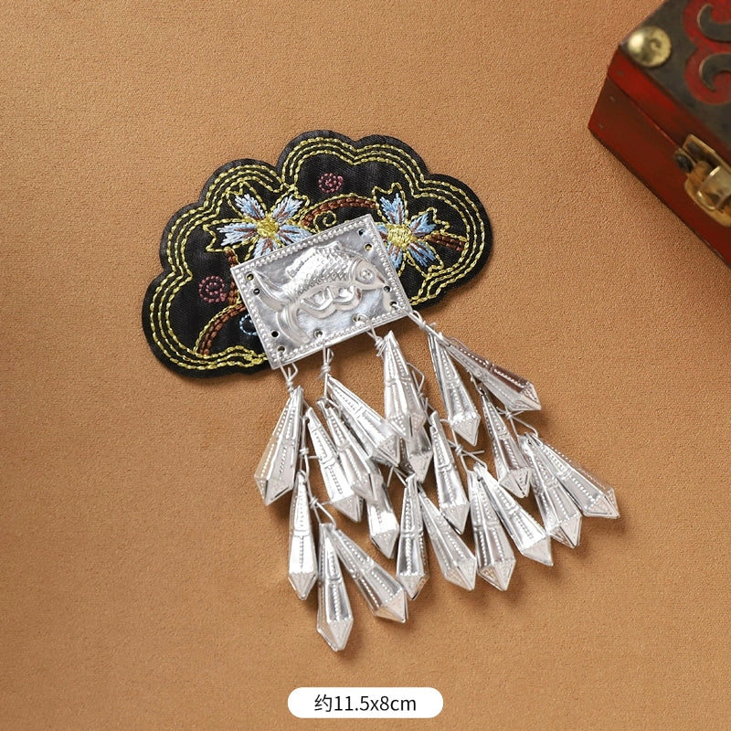 Black floral Guizhou Miao fridge magnet with silver arrowhead fringe, 11.5x8cm, handmade ethnic refrigerator ornament.