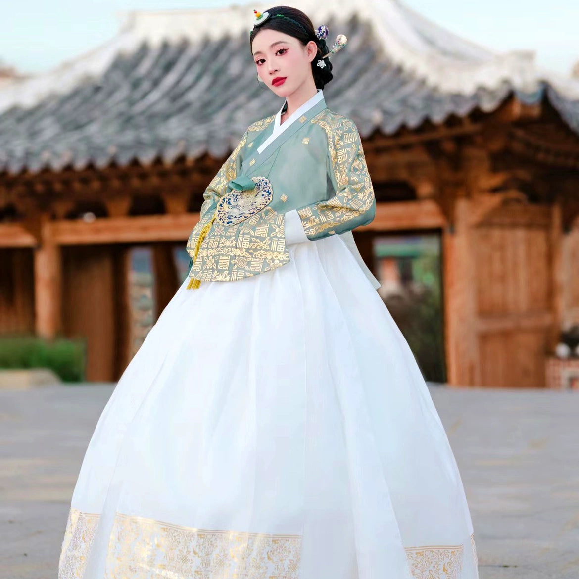 Elegant Korea Princess Palace Hanbok with gold accents and white skirt.