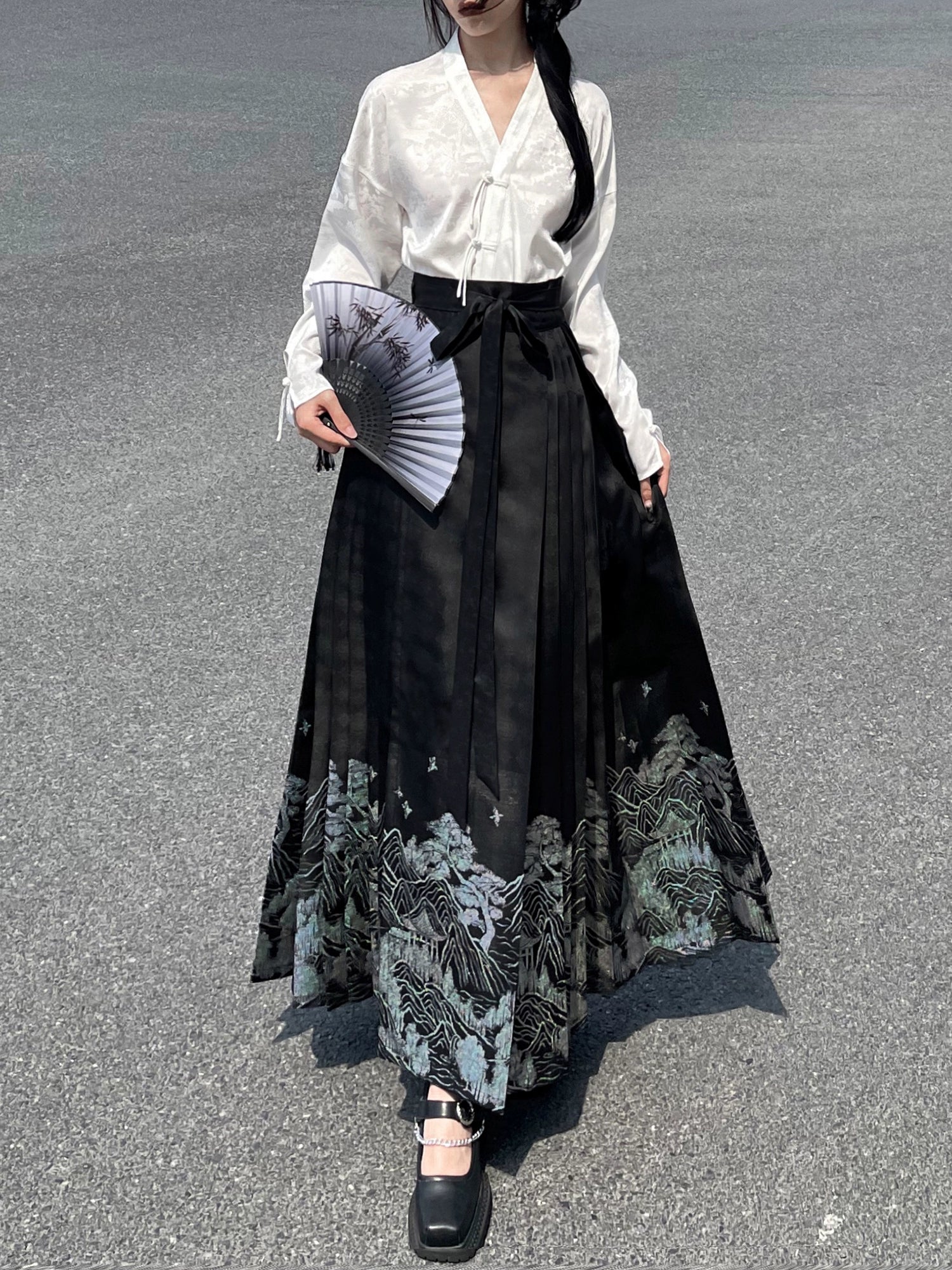 Explore modern elegance with our Black & White Shirt Women's Horse Face Skirt Suit. This ensemble blends traditional Hanfu design with contemporary flair, featuring intricate embroidery and authentic details. Embrace the timeless beauty of Hanfu fashion and make a statement with your unique style.