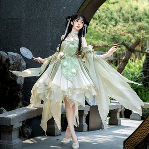 Model posing in Flower Marriage Green Lolita Dress with fan, highlighting the dress’s flowing chiffon and floral details.