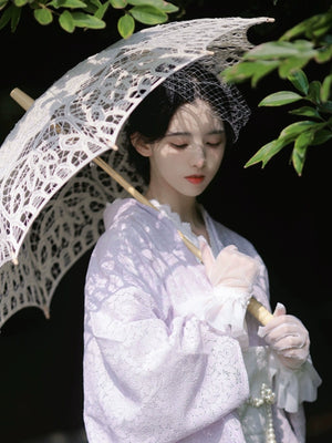 Purple lace kimono styled with a lace parasol for a vintage look.