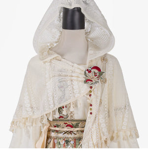 Hooded ivory lace shawl displayed on a mannequin