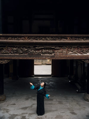 Black jacquard Xizang-inspired dress full-length studio styling view