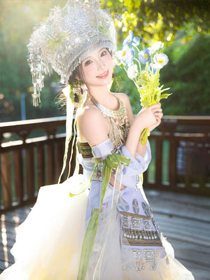Sunlit Pink Miao Clothing Women's Summer Cake Green Dress in green hues with silver detailing, styled for outdoor cultural events.