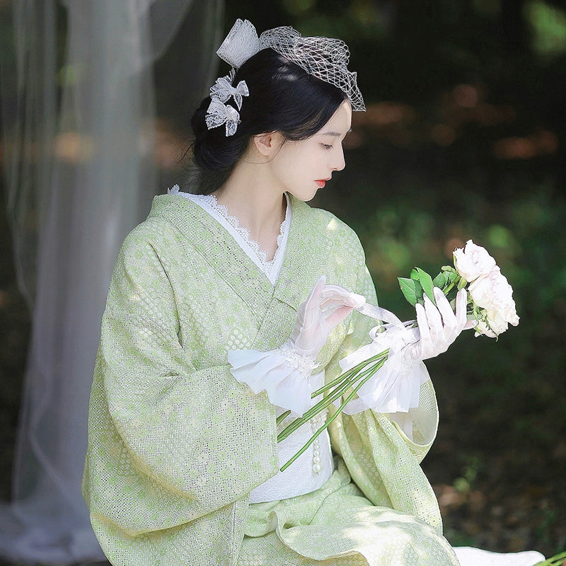 Elegant avocado green Taisho Roman kimono dress with lace details.