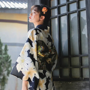 Side view of a Japanese kimono dress with a floral design, paired with a decorative obi belt, ideal for festivals and celebrations.