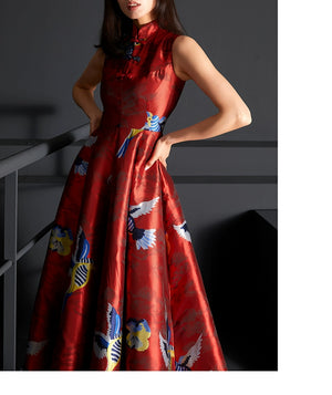 Detailed view of red satin cheongsam dress with intricate jacquard designs.