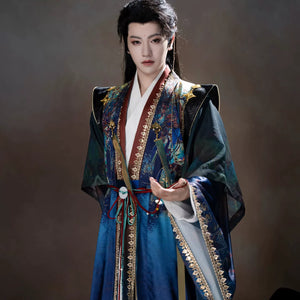 Layered blue outer robe with ornate multicolor artwork