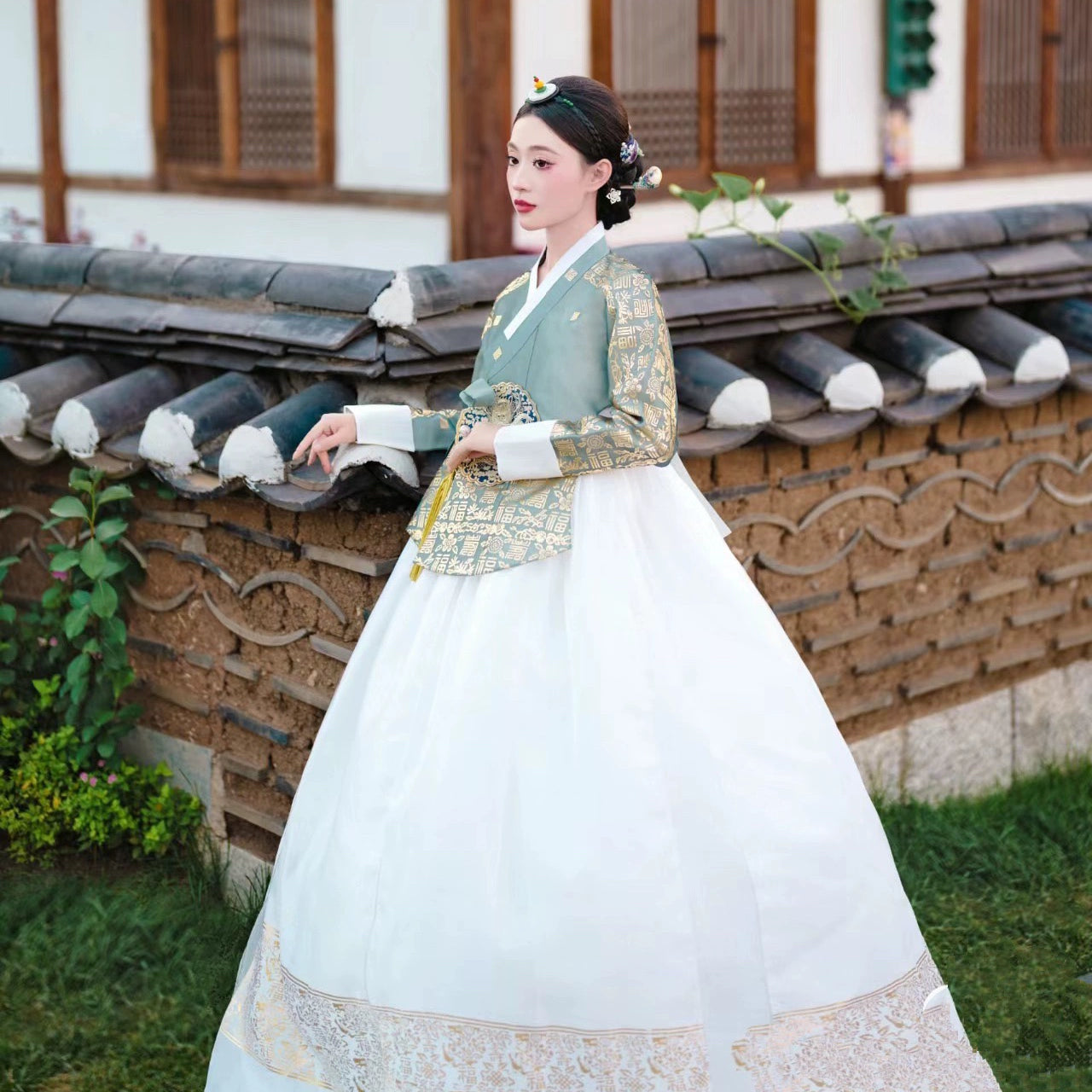 Traditional Korea Princess Hanbok with intricate gold patterns and white dress.