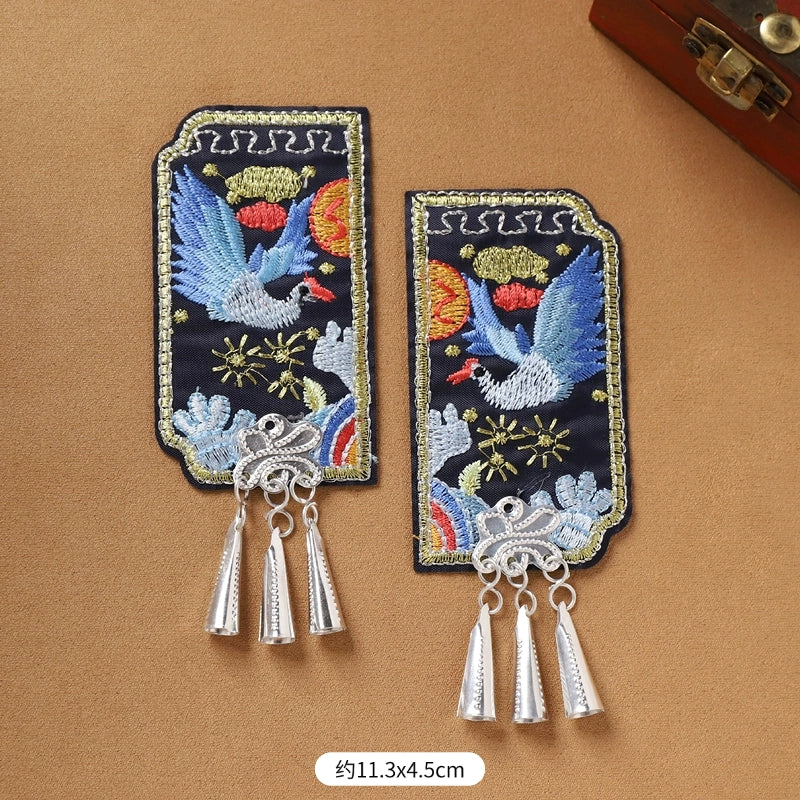 Pair of Guizhou Miao fridge magnets with blue bird embroidery and silver cone fringe, 11.3x4.5cm, handmade ethnic accessories.