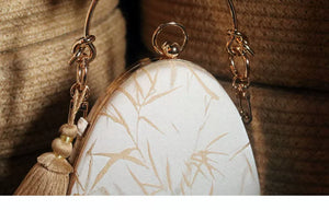 Bamboo weave and tassel charm closeup