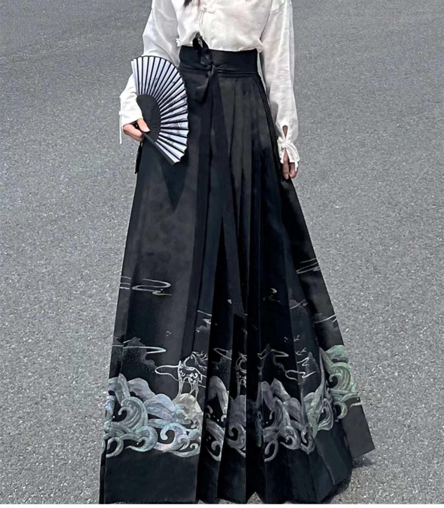 Explore modern elegance with our Black & White Shirt Women's Horse Face Skirt Suit. This ensemble blends traditional Hanfu design with contemporary flair, featuring intricate embroidery and authentic details. Embrace the timeless beauty of Hanfu fashion and make a statement with your unique style.