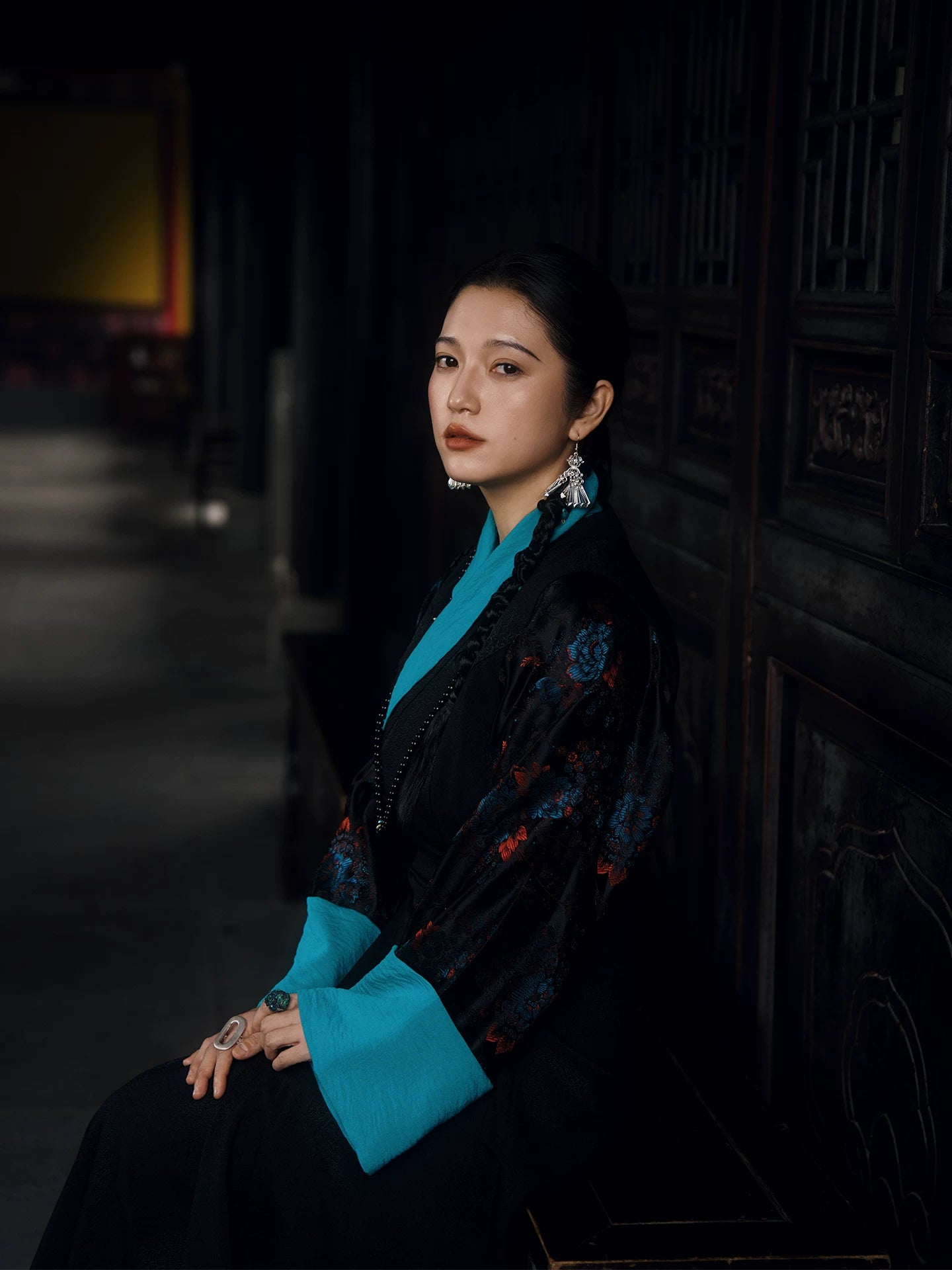Black Lhasa Xizang-inspired pinafore dress with aqua floral inner layer full outfit view
