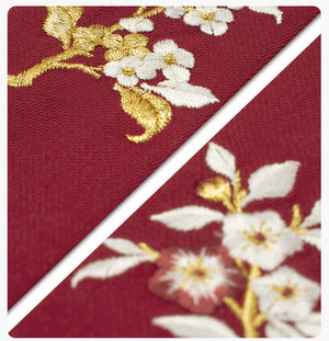 White and gold floral embroidery on red fabric of [Dan Que Acacia] New Chinese Style Red Wedding Dress close-up.