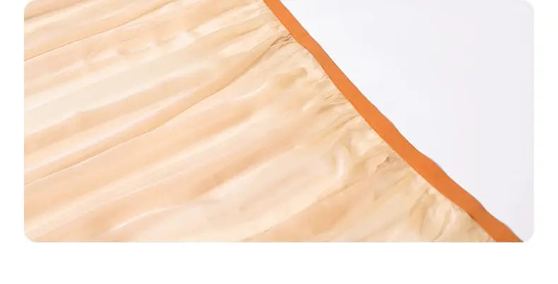 Close-up of sheer fabric with orange trim