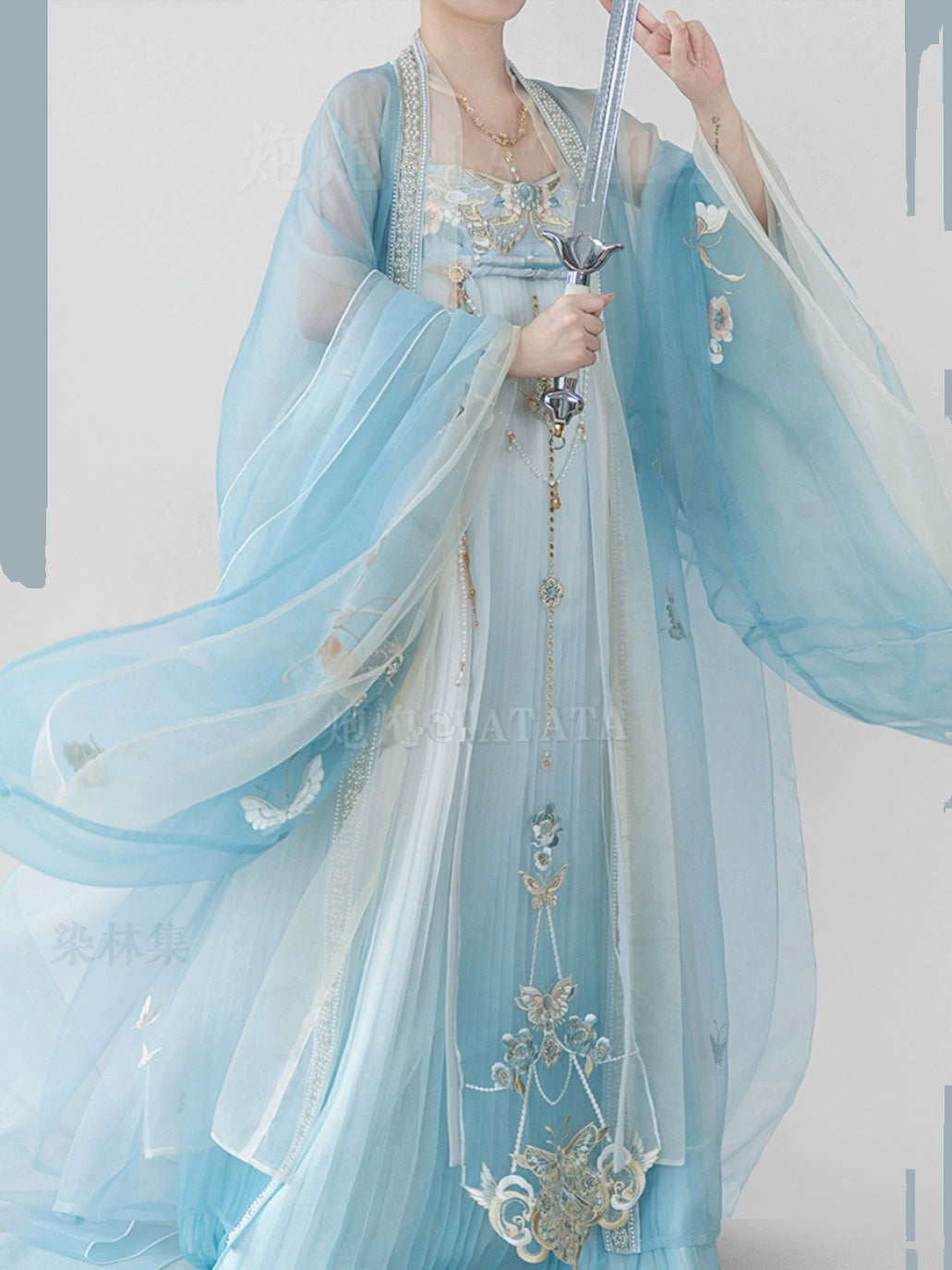 Step into the Timeless Elegance of Tang Dynasty with Our Princess Ensemble: Embroidered Wrap Skirt & Flowing Blue Dress. Explore the Rich Heritage of Tang Dynasty Fashion and Embrace the Beauty of Ancient Couture!