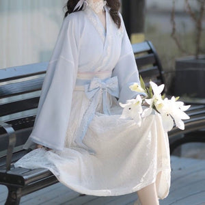 Blue Modern Hanfu Dress with lace skirt and floral accents, styled for spring with soft romantic tones and traditional design.