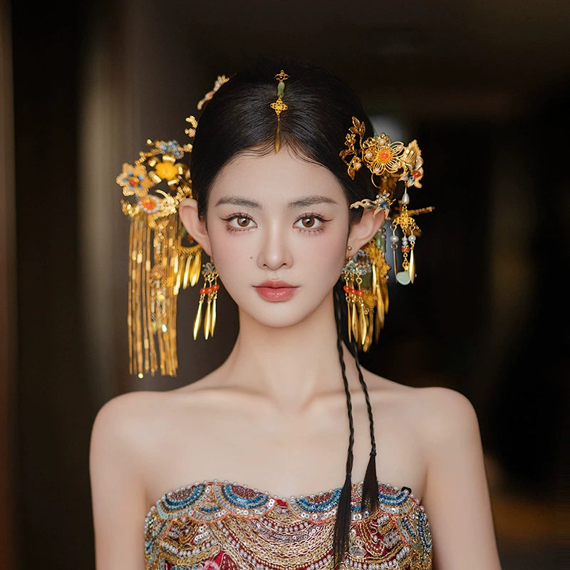 Gorgeous bridal tassel hairpin with antique Chinese butterfly design, worn with traditional embroidered dress for elegant wedding styling.