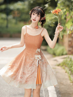Peach floral slip dress worn without the capelet