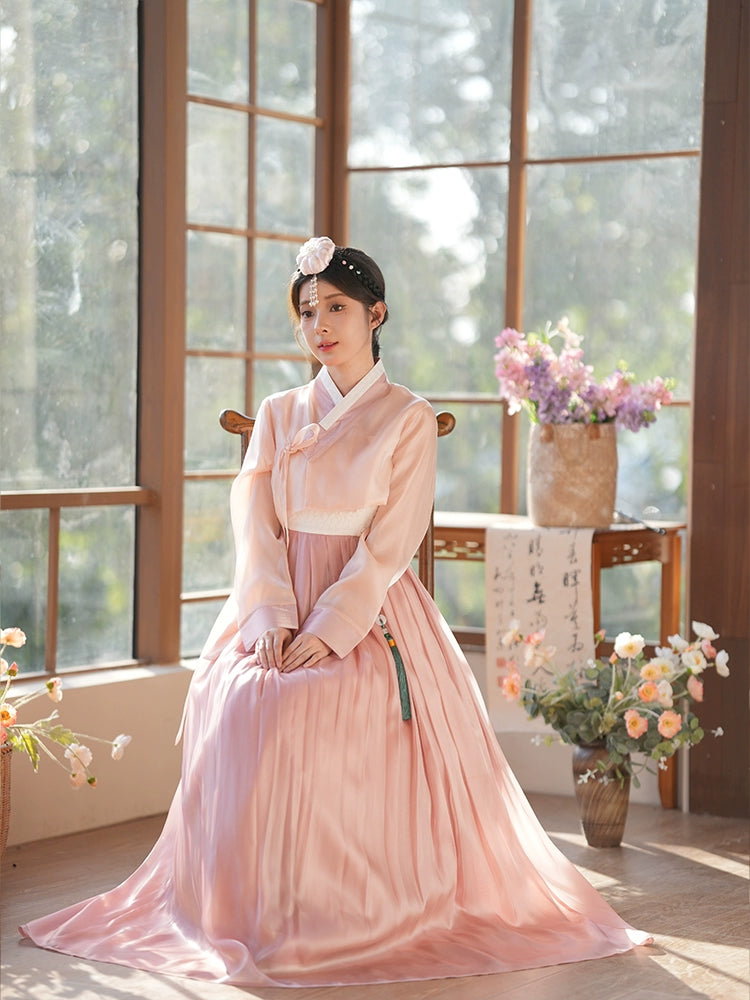 Authentic lotus root pink hanbok dress with delicate embroidery. Ideal for weddings, celebrations, and cultural gatherings.