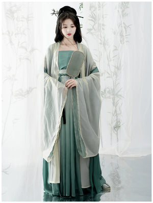 Elevate your style with our Hanfu Women's Green Daily Long Gown Wrap Skirt, inspired by the majestic beauty of the Song Dynasty. Explore our collection featuring Song Dynasty Hanfu, Hanfu skirts, and Hanfu shirts. Discover casual and princess-inspired Hanfu outfits, complemented by Dunhuang-inspired designs. Experience the allure of traditional Hanfu fashion with vibrant green hues and exquisite detailing.