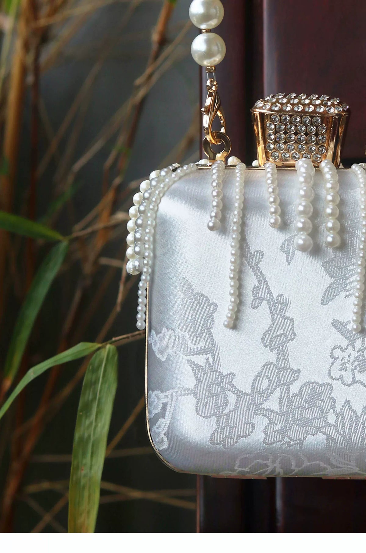 Satin pattern and pearl-style fringe detail