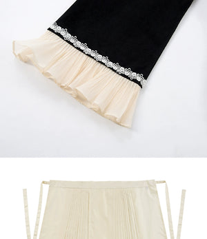 Cream pleated skirt with red embroidered hem, designed to pair with cheongsam dresses for formal occasions.