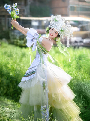 Model twirling in green Pink Miao Clothing Women's Summer Cake Green Dress with silver accents and layered tulle in a grassy setting.