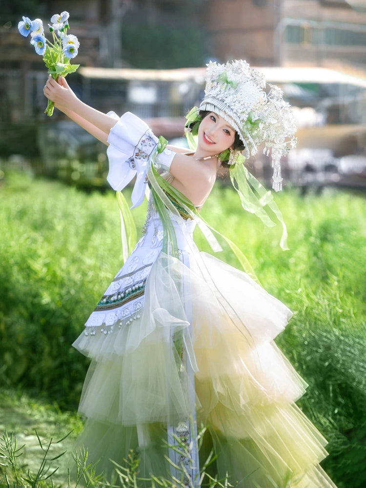 Model twirling in green Pink Miao Clothing Women's Summer Cake Green Dress with silver accents and layered tulle in a grassy setting.