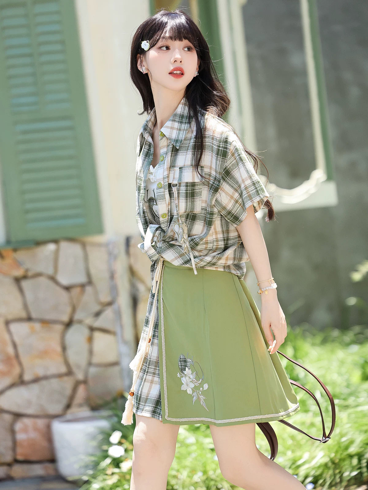 Green plaid modern hanfu short sleeve top with embroidered camisole and skirt styled on model