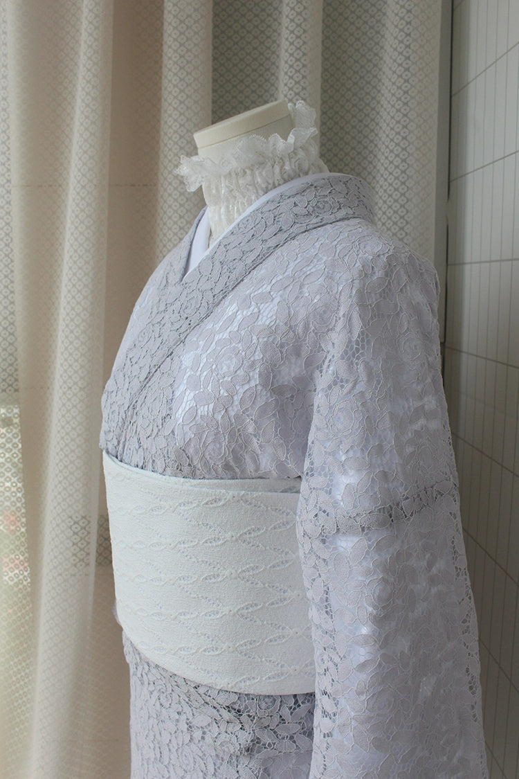 Close-up of a purple lace kimono with detailed lace patterns.