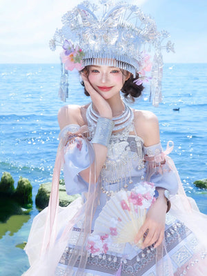 Model holding fan in Pink Miao Clothing Women's Summer Cake Green Dress with ornate silver jewelry and pastel tones, ideal for stage use.