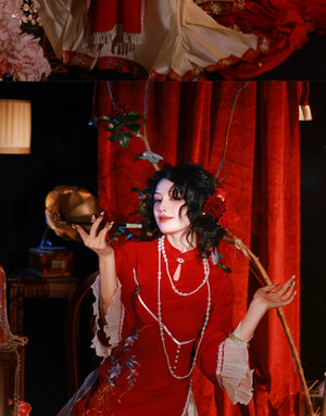 Red cheongsam dress styled with pearl necklaces and a fur shawl, featuring intricate embroidery for engagement or special events.