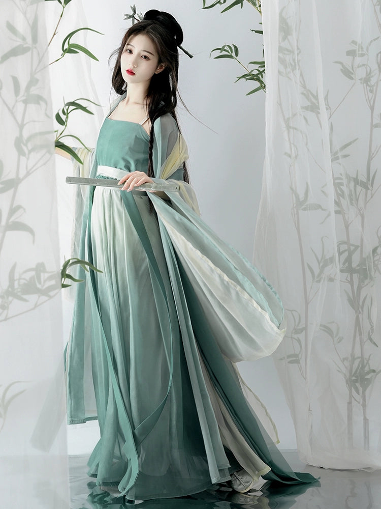 Elevate your style with our Hanfu Women's Green Daily Long Gown Wrap Skirt, inspired by the majestic beauty of the Song Dynasty. Explore our collection featuring Song Dynasty Hanfu, Hanfu skirts, and Hanfu shirts. Discover casual and princess-inspired Hanfu outfits, complemented by Dunhuang-inspired designs. Experience the allure of traditional Hanfu fashion with vibrant green hues and exquisite detailing.