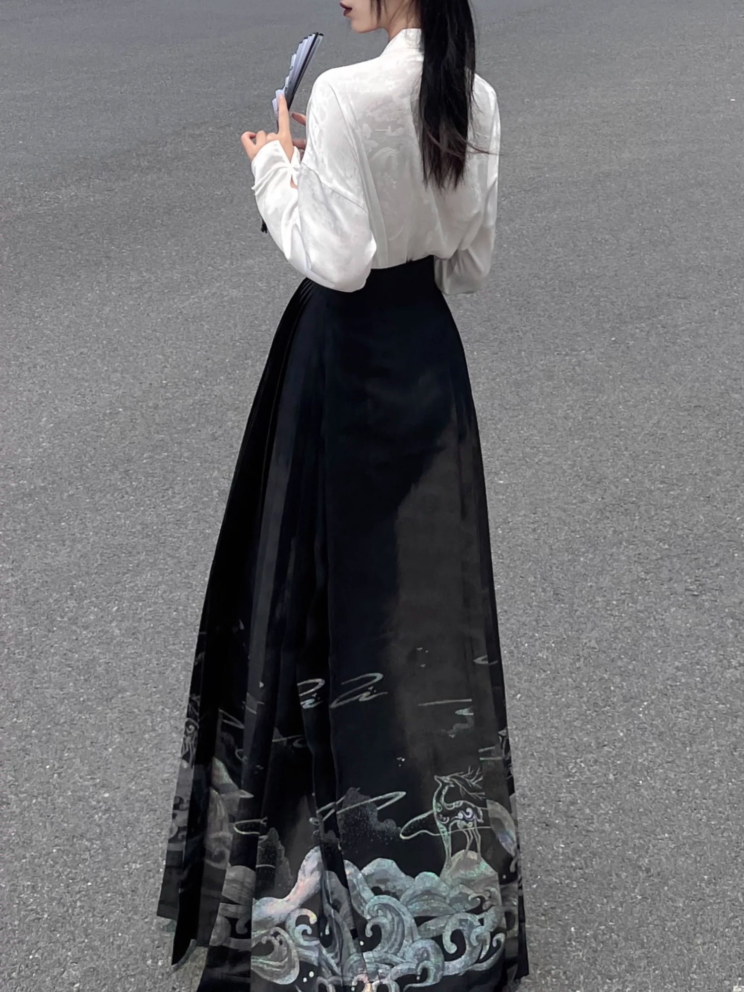 Explore modern elegance with our Black & White Shirt Women's Horse Face Skirt Suit. This ensemble blends traditional Hanfu design with contemporary flair, featuring intricate embroidery and authentic details. Embrace the timeless beauty of Hanfu fashion and make a statement with your unique style.