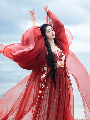 Step into the opulent world of Tang Dynasty elegance with our exquisite Red Hanfu Ensemble. Featuring a chest-length wrap skirt adorned with intricate super fairy embroidery and paired with a flowing large-sleeved top suit, our ensemble captures the essence of Tang Dynasty grandeur and sophistication. Embrace the rich heritage and timeless beauty of ancient Chinese fashion with our stunning collection.