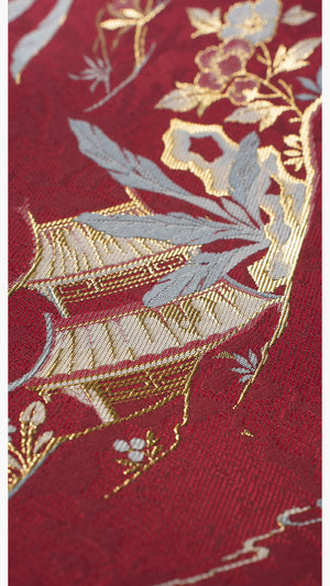 Close-up of bamboo and floral embroidery on [Dan Que Acacia] New Chinese Style Red Wedding Dress fabric.