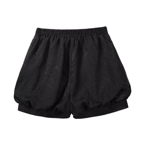 Black bloomer shorts displayed separately