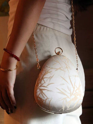 Teardrop bag worn on its chain strap