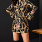 Stylish jacquard dress suit with gold and pink floral patterns.