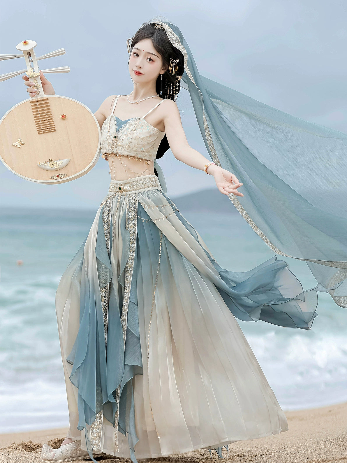 Dunhuang Goddess Hanfu Dress in lake blue with flowing chiffon layers, ideal for summer beachwear and ancient Chinese fashion styling.