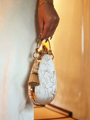 Side profile of the structured teardrop handbag