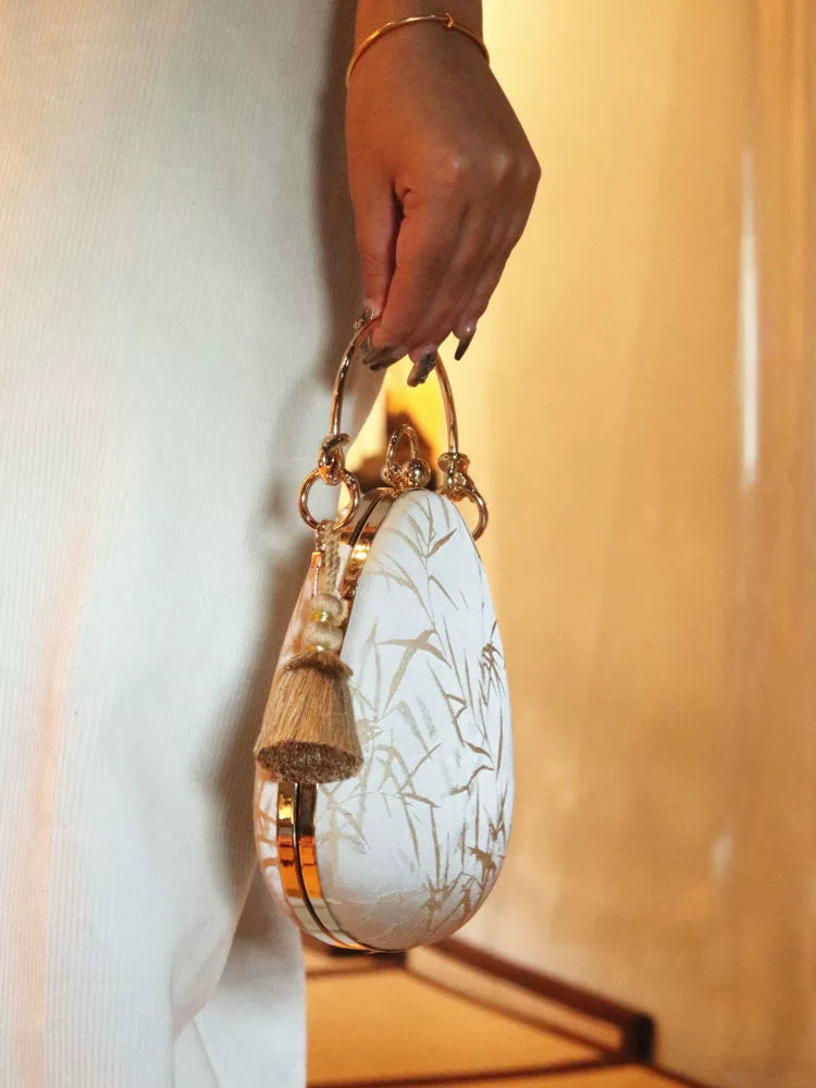 Side profile of the structured teardrop handbag