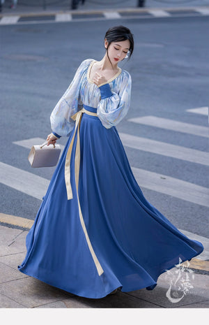 This blue modern hanfu features elegant hanfu sleeves, a stylish hanfu jacket, and timeless charm. Perfect for a princess hanfu dress, fairy hanfu dress, or casual hanfu, it suits every hanfu woman. Layer with a hanfu shirt or wear as a modern hanfu dress, inspired by Ming Dynasty hanfu. Ideal for hanfu cosplay or as a cozy winter hanfu, it’s available at our trusted hanfu shop. Wondering where to buy hanfu? Start here for authentic styles.