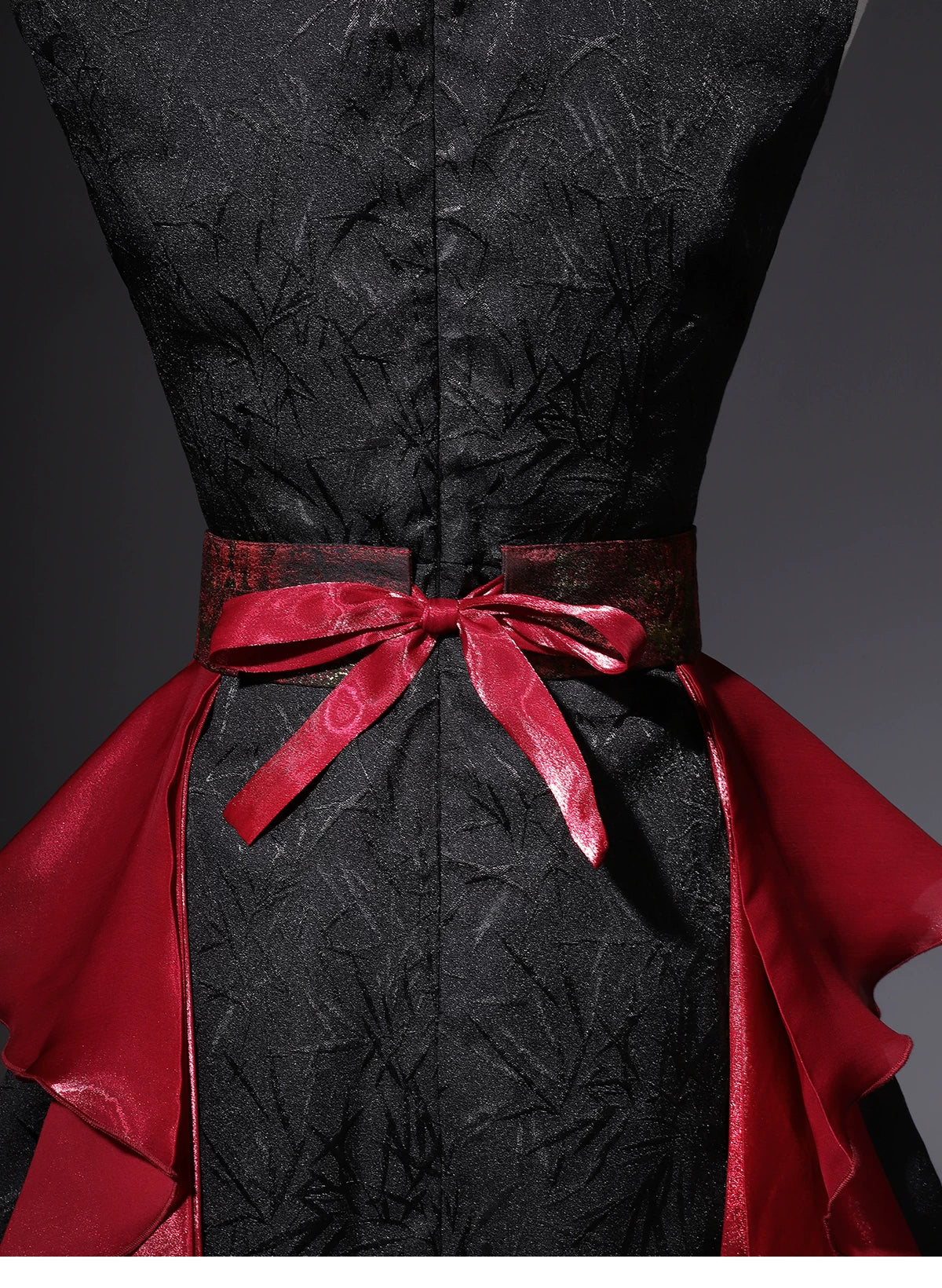 Rear waist sash tie and textured black fabric