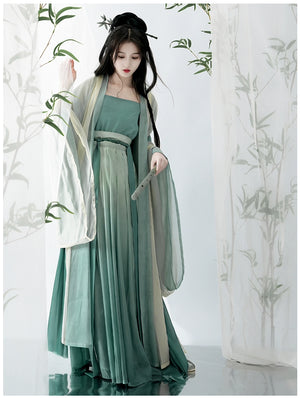 Elevate your style with our Hanfu Women's Green Daily Long Gown Wrap Skirt, inspired by the majestic beauty of the Song Dynasty. Explore our collection featuring Song Dynasty Hanfu, Hanfu skirts, and Hanfu shirts. Discover casual and princess-inspired Hanfu outfits, complemented by Dunhuang-inspired designs. Experience the allure of traditional Hanfu fashion with vibrant green hues and exquisite detailing.