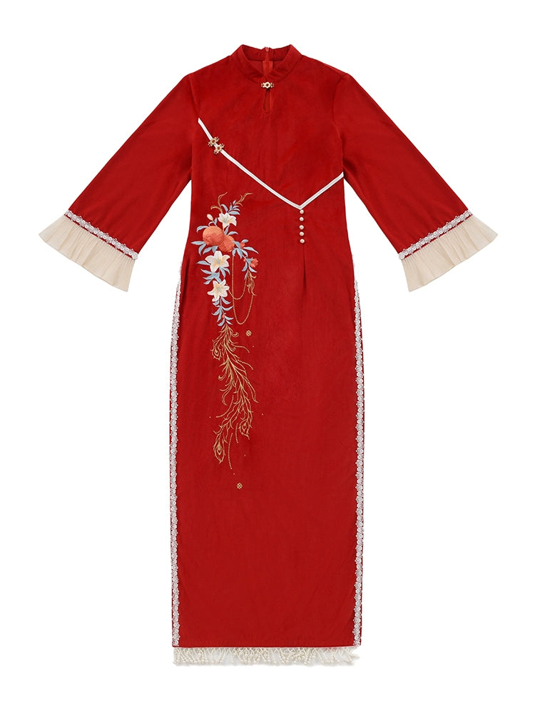 Red cheongsam dress with floral embroidery and tassel details, featuring cream pleated skirt for engagement or special occasions.