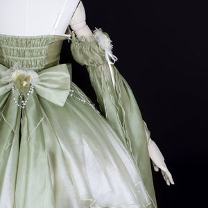 Back waist detail of Green Lolita Dress with bow and pearl strands, styled for Chinese Lolita summer fashion.